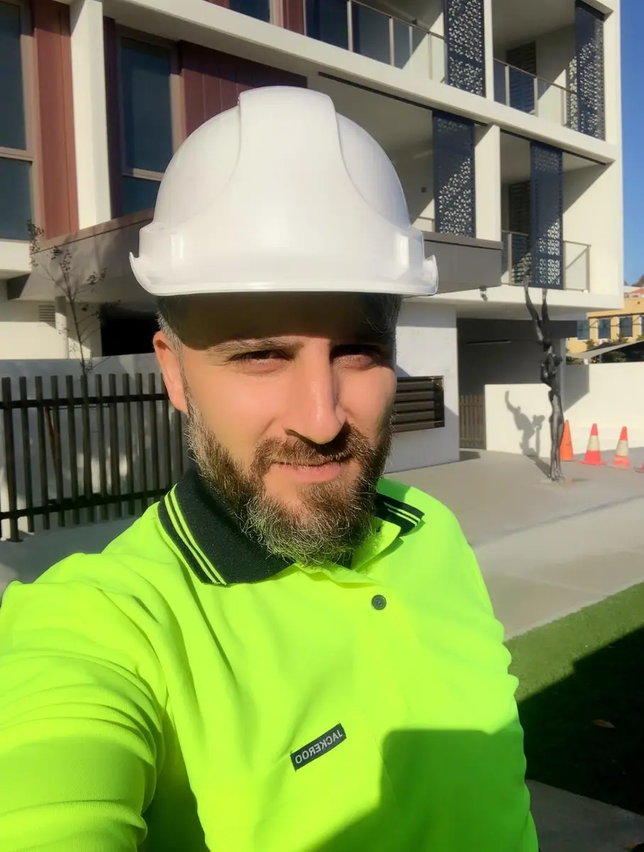Kevin in a hard hat on a Perth building site