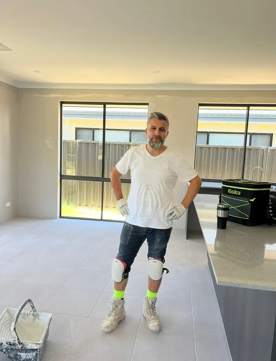 Kevin, owner of Mitan Painting, in a freshly painted new home