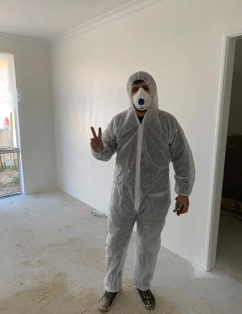 Kevin in spray suit and mask for spray painting a new build