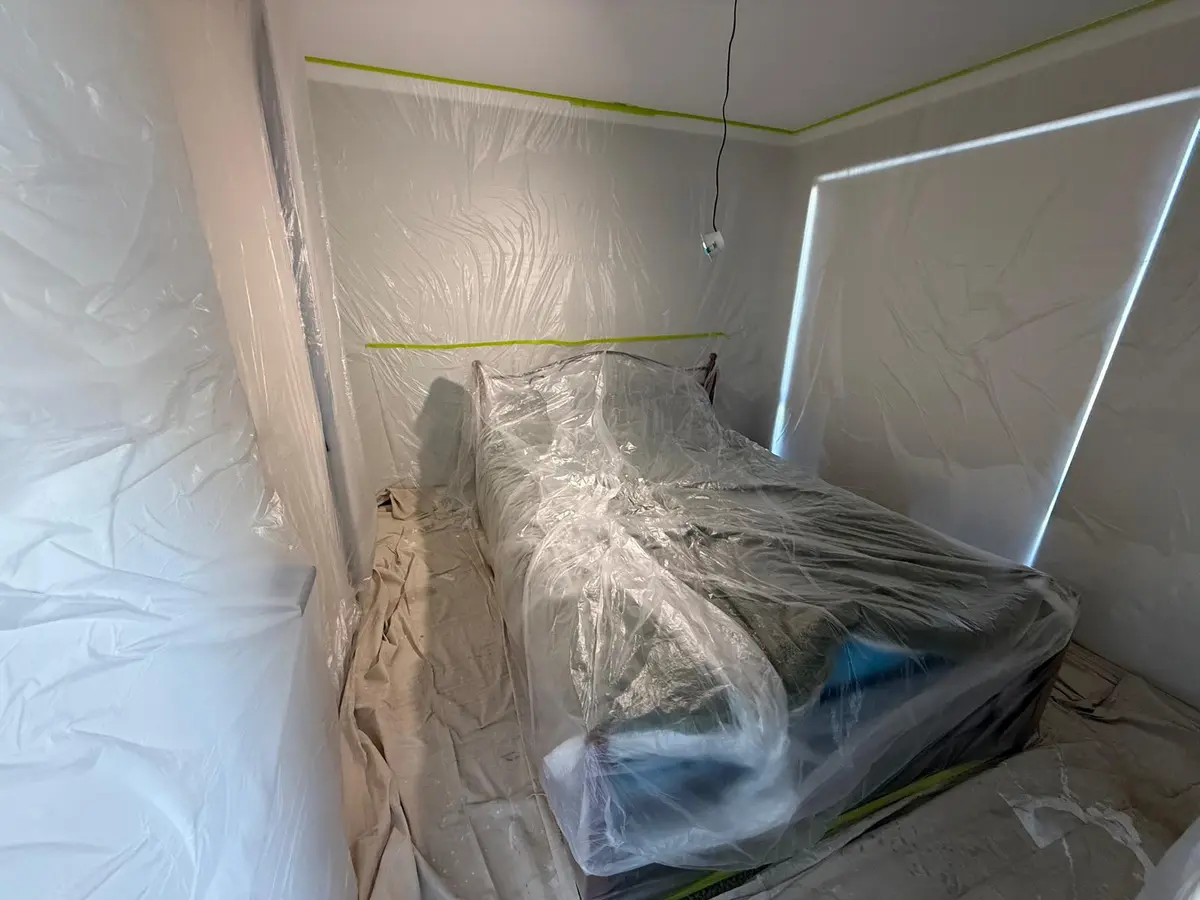 Bedroom fully masked and covered before painting
